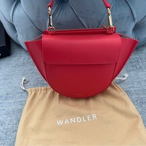 Wandler classic moon shaped handbag in bright poppy watermelon red.